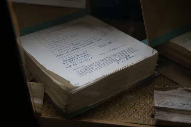 Old railroad papers in Avery, Idaho showcasing historical records and transportation details. Reputation management operations: from source record to publication