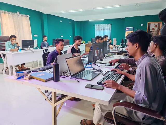 Young professionals working in a bright, modern office environment on computers, fostering collaboration and productivity. An evidence room for a reputation supplier, arranged in five folders